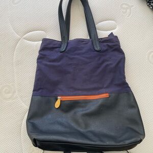 Blue & Black convertible backpack / orange trim & interior
